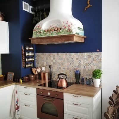 A colorful meadow with a view of the lake, traditional cooker hood with shelf.