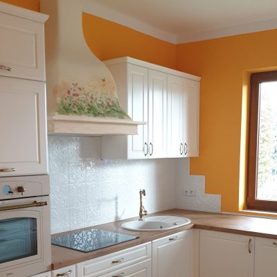 Traditional, handmade cooker hood with wooden frame.